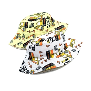 Detailed close-up of double-sided kids bucket hats with excavator and work zone prints
