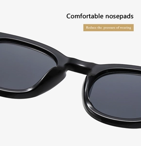 Close-up of comfortable integrated nose pads on black oval sunglasses for pressure relief