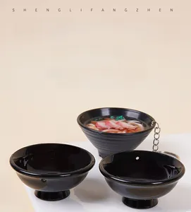 Macro detail of miniature Japanese ramen bowls with food model and keychain attachment