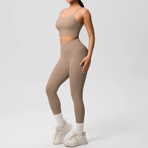Detail of high-waist yoga leggings and sports bra in matte brushed beige fabric
