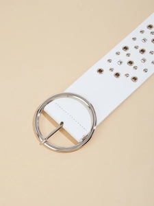 Close-up of white PU leather belt featuring silver round buckle and metal stud detailing