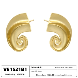 Macro detail of spiral C-shaped brass earrings with 22.5x26mm size and 4.8g weight