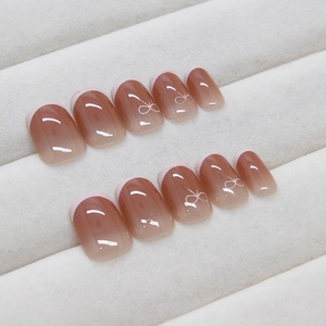 French gradient press-on nails with white bow designs and glossy finish 24pcs set