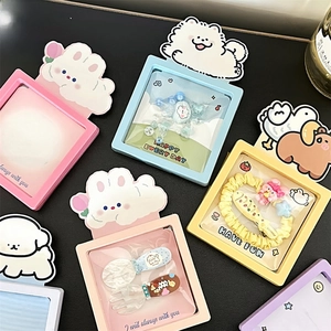Detailed top view of colorful cartoon jewelry packaging boxes with assorted small accessories