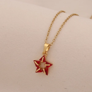 Golden stainless steel necklace featuring a vibrant red star zircon pendant for women