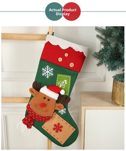 Close-up of a large Christmas stocking with 3D reindeer design and plush white cuff decoration