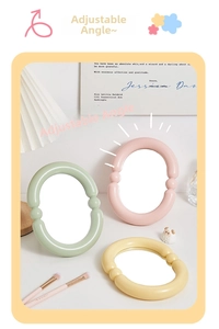 Detail of adjustable candy-colored oval desktop mirrors in soft pastel mint and pink hues