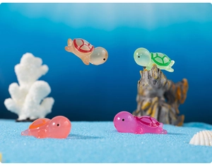 Micro landscape detail of colorful luminous resin mini turtles in an undersea scene