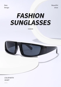Close-up of black punk Y2K wrap sunglasses on a white minimalist geometric studio display