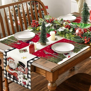 Christmas table runner and placemat set with Santa Claus and snowman patterns on wood table