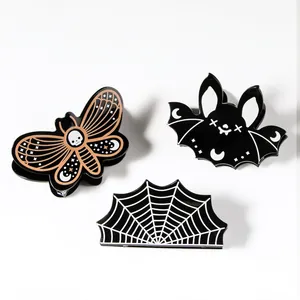 Halloween claw clip set featuring moth, black bat and spider web acrylic hair accessories