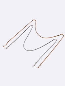 Detail of gold and silver box chain mask holders with adjustable white silicone loops