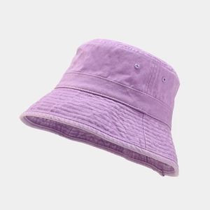 Detail of purple washed cotton bucket hat showing stitching and breathable embroidered eyelet