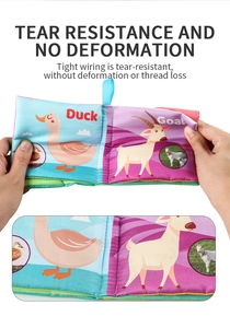 Detail of durable tear-resistant baby cloth book showing colorful duck and goat illustrations