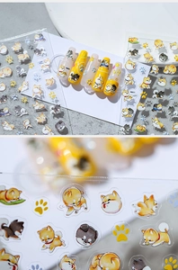 Macro detail view of 3D Shiba Inu cartoon nail art stickers with cute paw prints