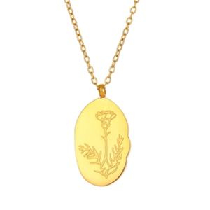 Détail d'un pendentif ovale plaqué or orné d'un motif floral de chardon recto-verso