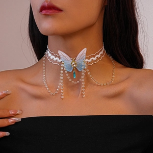 Detail of white lace choker with gradient blue butterfly and crystal bead tassels