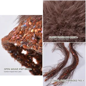 Women's autumn plush knit beanie with hollow brim and decorative furry strings in brown