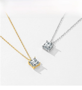 Detail of square-cut zircon necklaces in gold and silver plating with prong settings