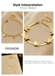 Macro detail of gold butterfly charms on snake and O-link stainless steel bracelets