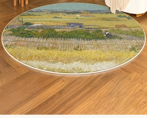 Detail of round rug with Van Gogh Harvest oil painting print and cream stitched edges