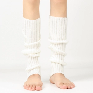 Close-up of white ribbed knit leg warmers showing soft wool texture and vertical stripes