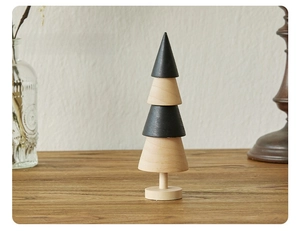 Detail view of Style A wooden mini Christmas tree with black and natural wood layers