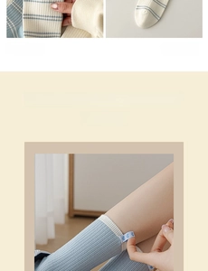 Detailed knit texture of light blue striped socks with heart woven label detail