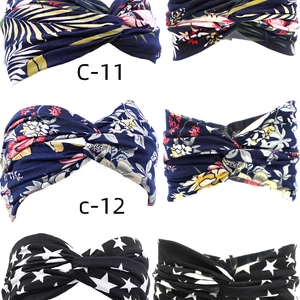 Detail of bohemian elastic headbands featuring tropical leaves and floral patterns