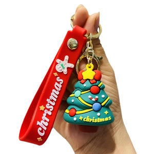 Cute Christmas keychain with green tree pendant and red wrist strap for festive bags