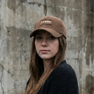 Vintage distressed brown cotton baseball cap with LA&DH embroidery on street style model