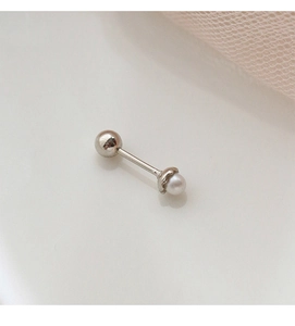 Macro view of sterling silver screw-back stud earring with single white pearl and petal setting