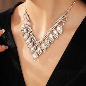 Close-up of elegant V-shaped marquise rhinestone necklace on a model for a luxury look