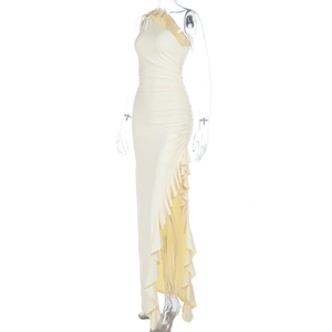 Close-up of cream ruffled side slit on a sexy one-shoulder knit vacation maxi dress