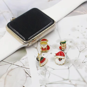 Close-up of 4pcs Christmas themed silicone watch band charms featuring Santa and tree