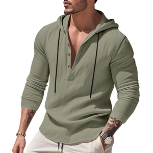 Detail of olive green linen henley hoodie featuring three buttons and black drawstrings