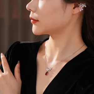 Elegant zircon flower tassel necklace and matching ear bone clip set with red teardrop pendant
