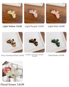 Detail showing seven colors of 7.6cm butterfly claw clips in glossy acetate finish