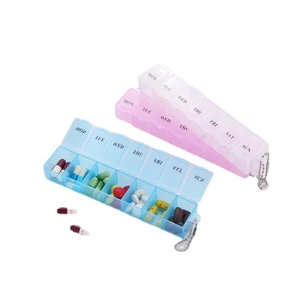 Portable 7-day pill box organizer with blue and pink cases and metal keychains