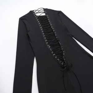 Close-up of the back cross-lace-up design with metal eyelets on a black slim-fit dress