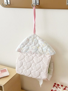 Detail of quilted heart tissue holder with rooftop shape and pink checkered pattern