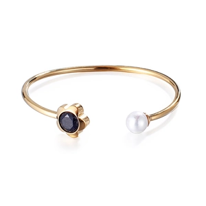 Gold-plated open bangle with floral motif, blue sandstone inlay and a white pearl accent