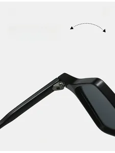Detail showing the durable metal hinge and smooth black frame of geometric sunglasses