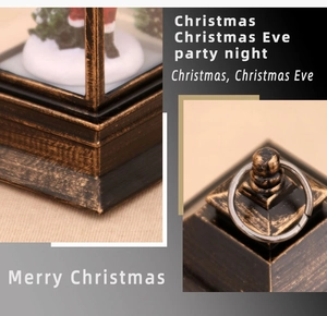 Detail of vintage Christmas lantern featuring golden finish base and top hanging ring