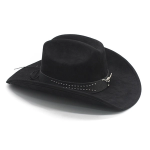 Detail of bull head emblem and studded leather band on black faux suede cowboy hat