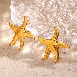 Golden starfish stud earrings with a textured finish for a beach vacation look