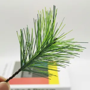 Artificial green pine needles branch for Christmas wreaths and holiday decorations