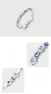 Macro shot of S925 sterling silver stamp and blue enamel evil eye with heart zircon