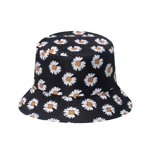 Casual black bucket hat with white daisy floral print and reinforced stitching details