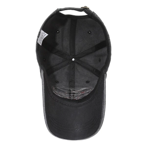 Interior view of vintage black washed cotton baseball cap with adjustable metal buckle